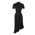 Black dress with short sleeves and a high neckline on a white background