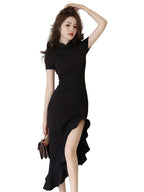 Woman wearing a black dress with a plain background