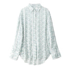 Light blue floral patterned shirt on a white background
