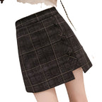 Plaid skirt worn by a person on a white background