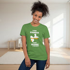 Woman wearing a green t-shirt with text and graphics on a plain background