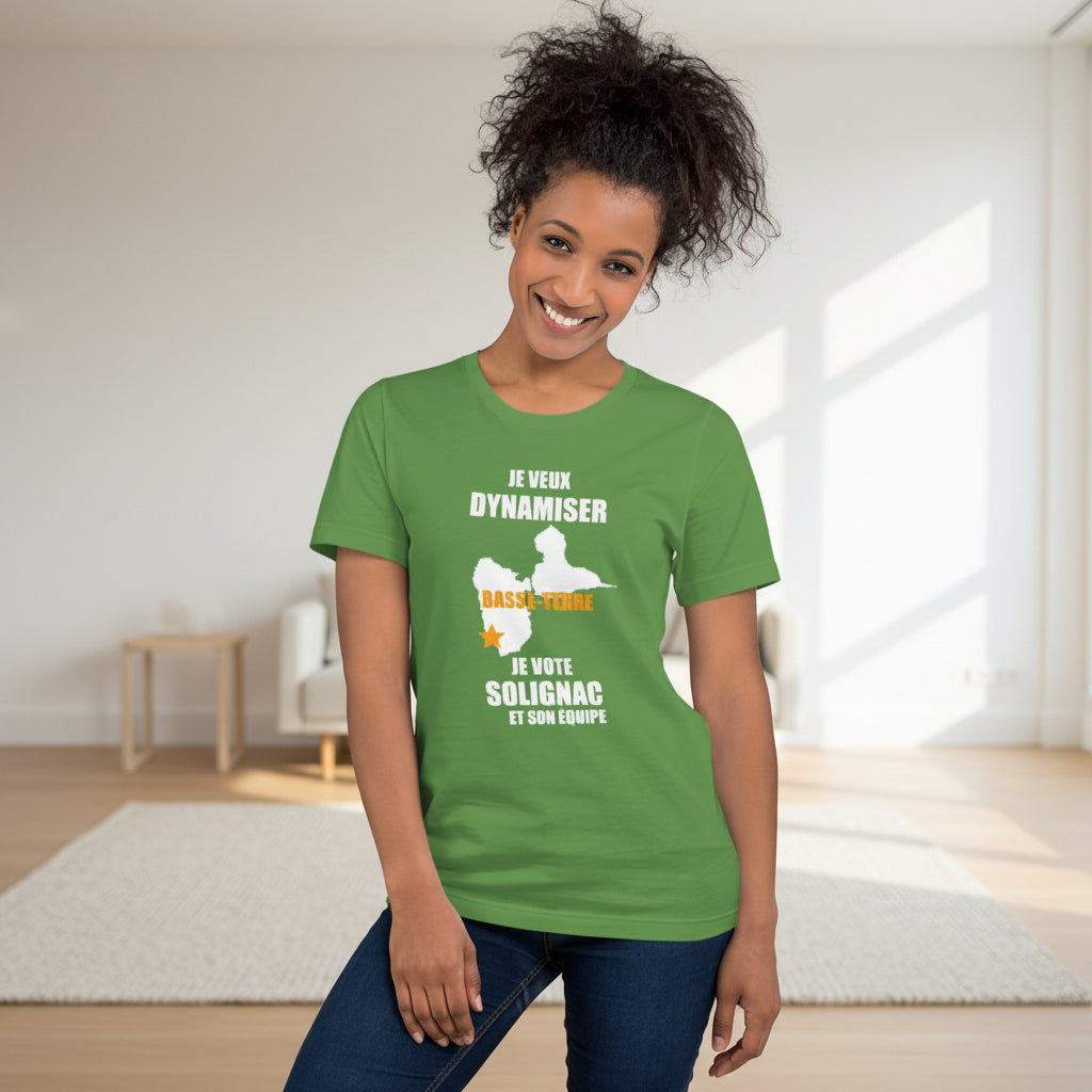 Woman wearing a green t-shirt with text and graphics on a plain background