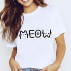 Person wearing a white t-shirt with 'MEOW' printed on it against a plain background
