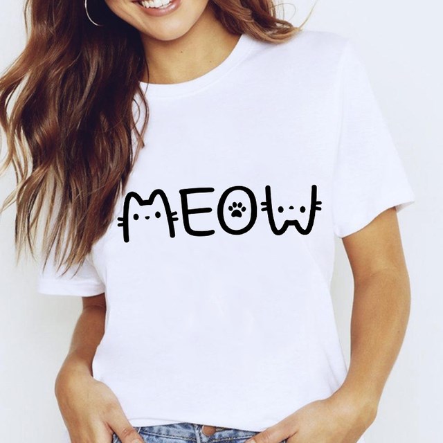 Person wearing a white t-shirt with 'MEOW' printed on it against a plain background