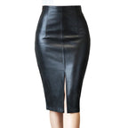 Black leather pencil skirt with a front slit on a textured gray background
