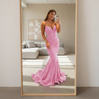 Pink sparkly dress worn by a person on a white background